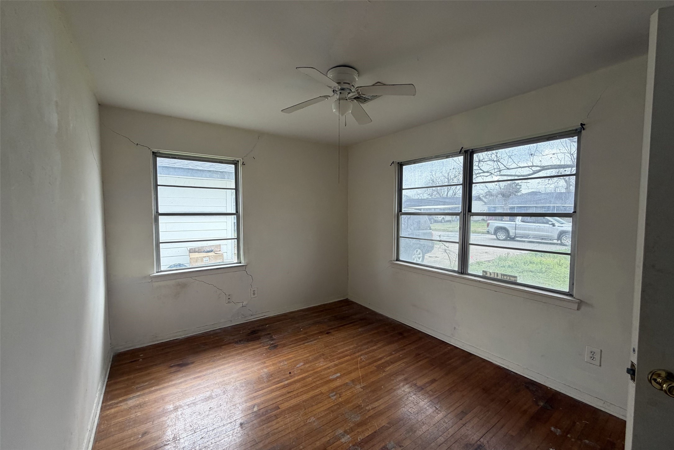 3207 Washington Street Pasadena, TX 77503 - Photo 6 of 9 a view of an empty room with wooden floor and a window