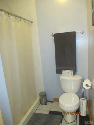 a bathroom with a toilet and a sink