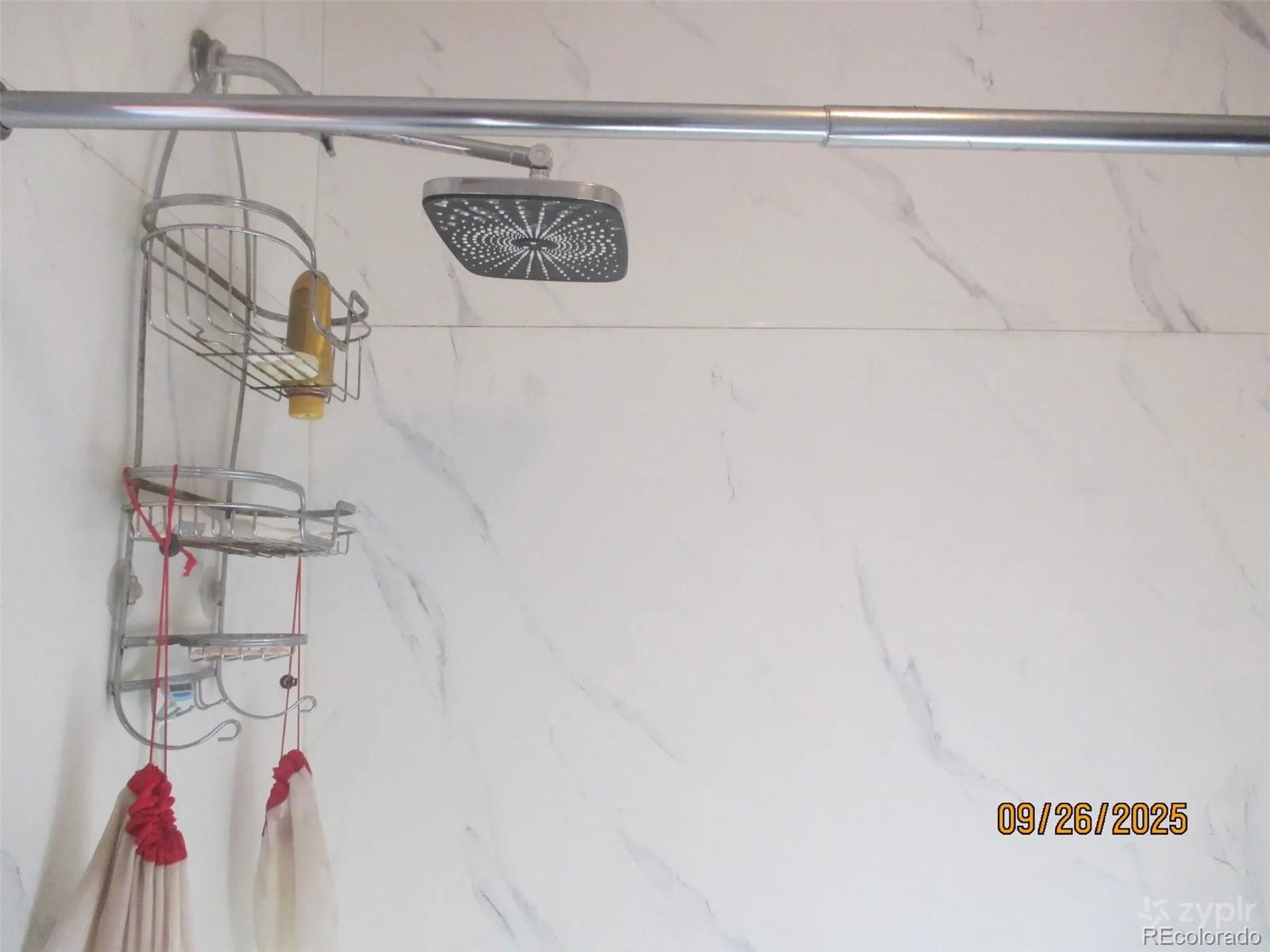 15 Sloan Road Livermore, CO 80536 - Photo 13 of 27 a bathroom with a shower and vanity in it