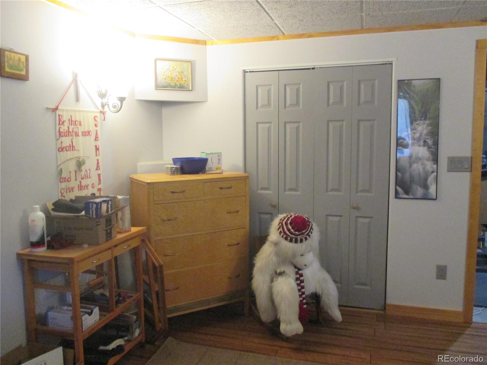 15 Sloan Road Livermore, CO 80536 - Photo 26 of 33 a room with toys and wooden floor