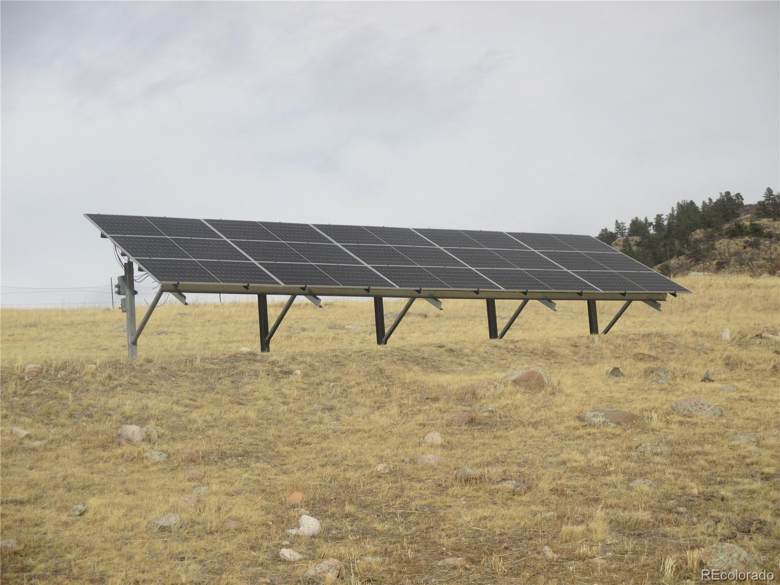 15 Sloan Road Livermore, CO 80536 - Photo 28 of 33 a view of a terrace with table and chairs