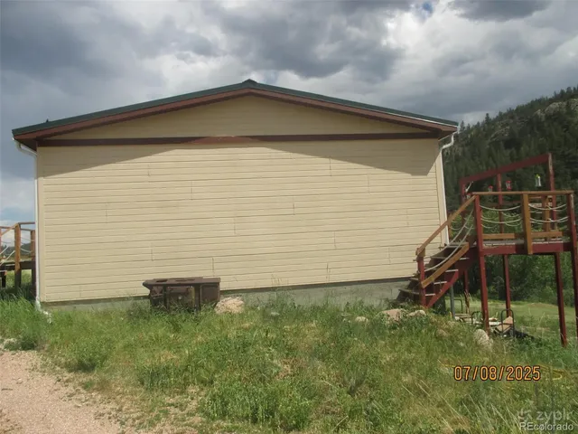 a side view of a house with a yard