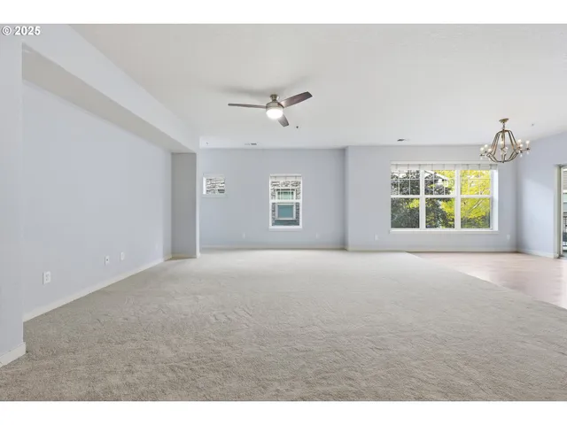 a view of a kitchen with a sink and stainless steel appliances