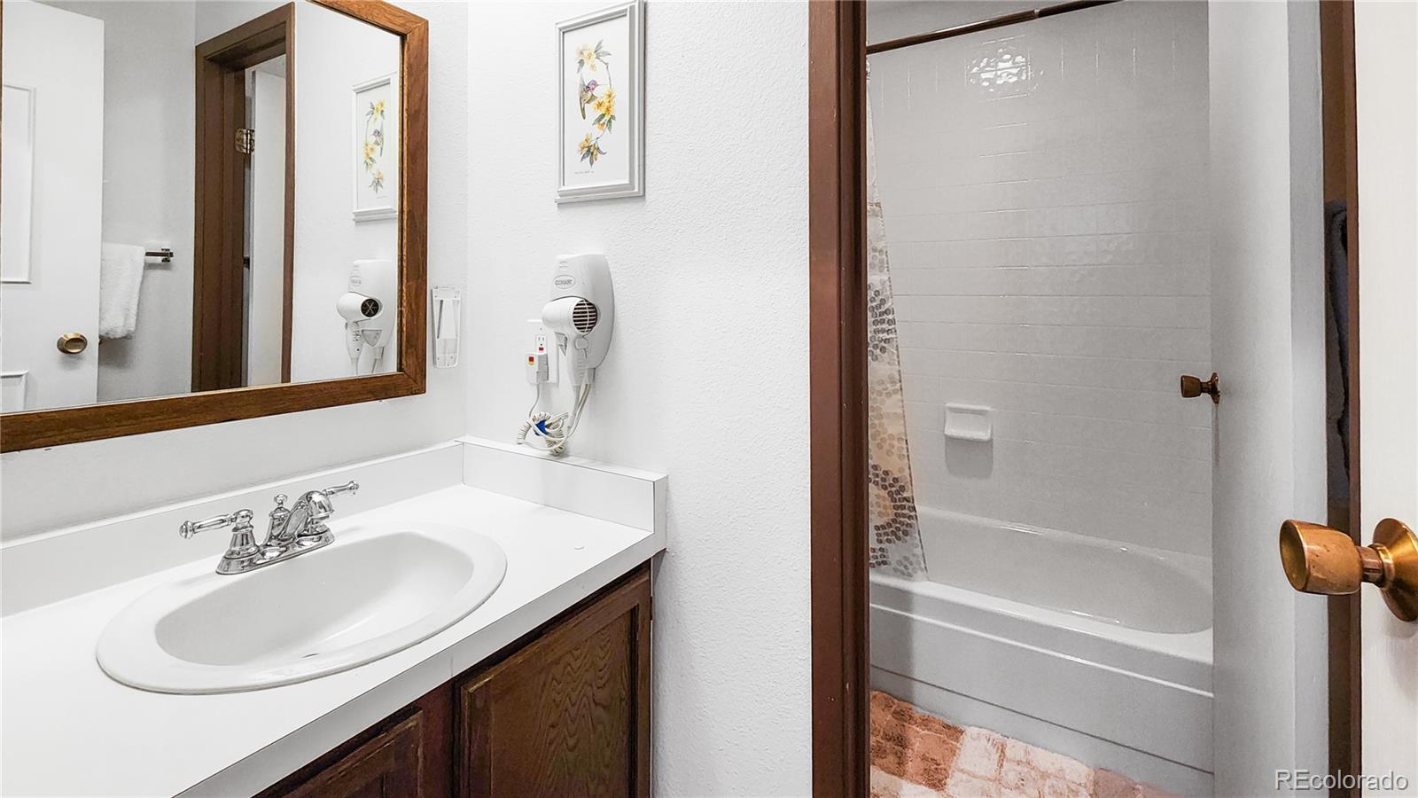 1977 Soda Ridge Road, Unit 1180 Dillon, CO 80435 - Photo 13 of 24 a bathroom with a sink and a mirror