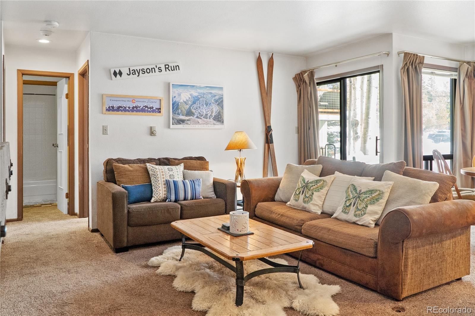 1977 Soda Ridge Road, Unit 1180 Dillon, CO 80435 - Photo 4 of 24 a living room with furniture and a large window