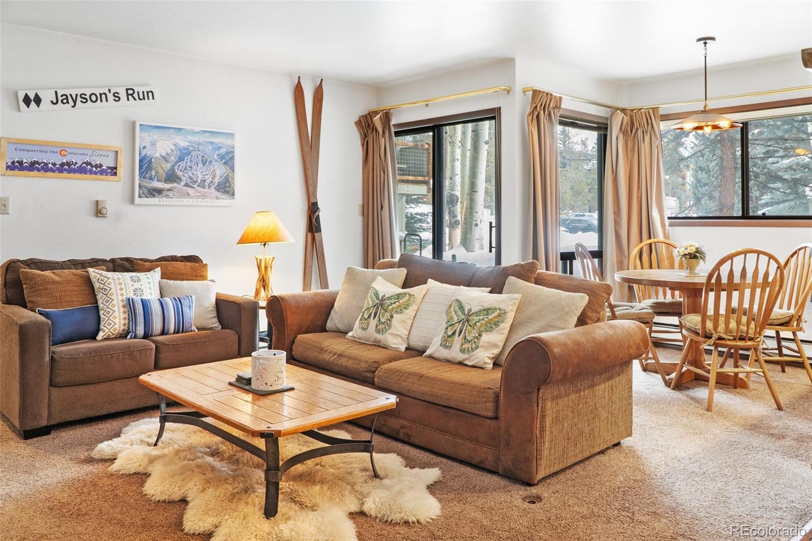 1977 Soda Ridge Road, Unit 1180 Dillon, CO 80435 - Photo 5 of 24 a living room with furniture and a large window