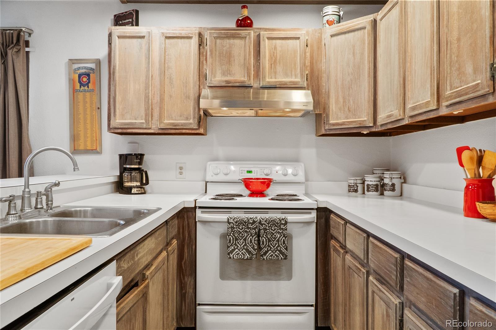 1977 Soda Ridge Road, Unit 1180 Dillon, CO 80435 - Photo 8 of 24 a kitchen with stainless steel appliances granite countertop a sink dishwasher and cabinets with wooden floor