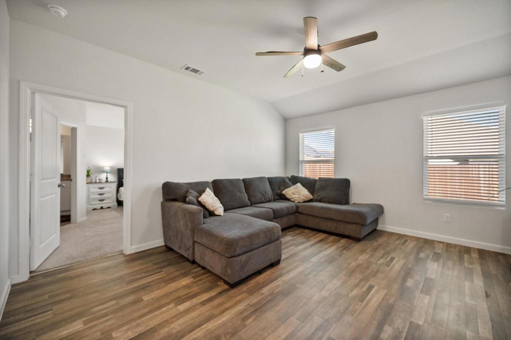 909 Avagail Avenue Springtown, TX 76082 - Photo 15 of 26 a living room with furniture and a wooden floor
