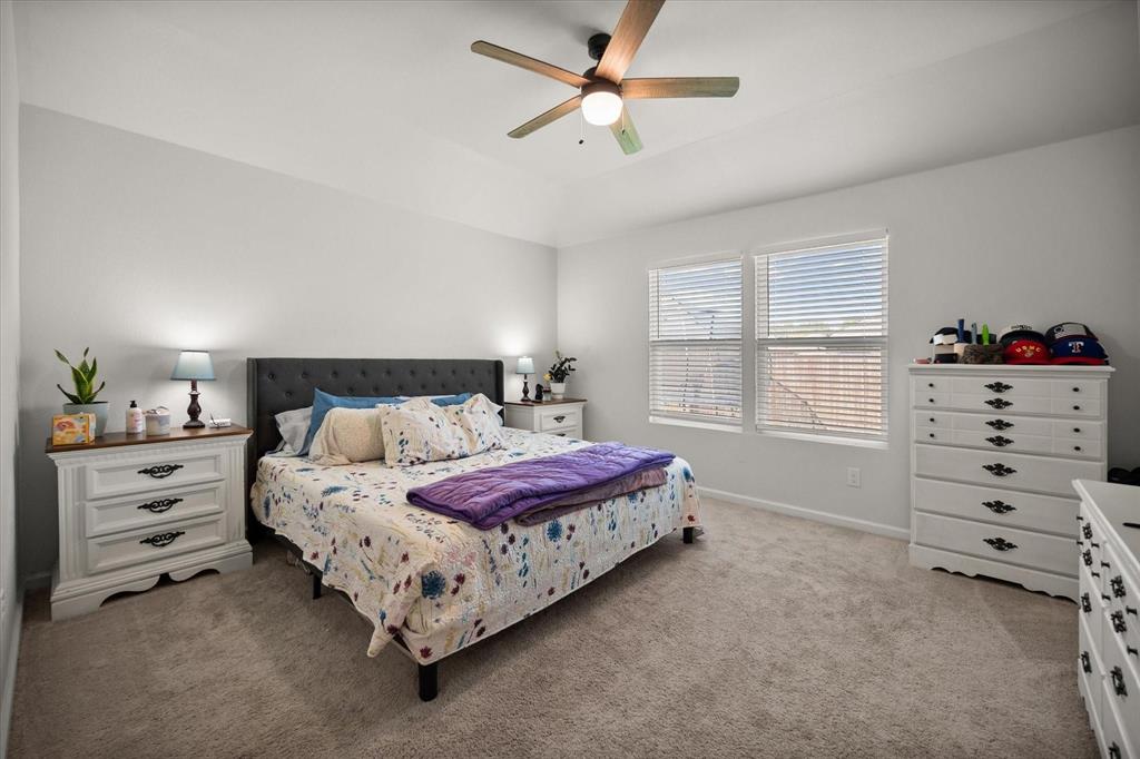 909 Avagail Avenue Springtown, TX 76082 - Photo 16 of 26 a spacious bedroom with a bed and a window