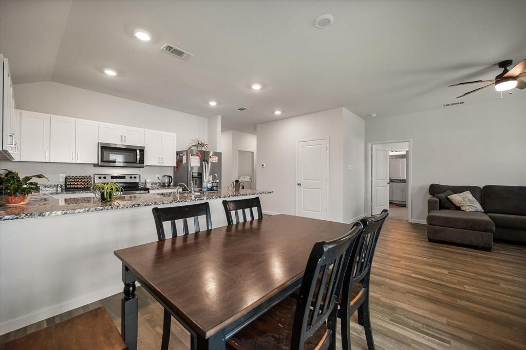 909 Avagail Avenue Springtown, TX 76082 - Photo 7 of 26 a view of a dining room with furniture