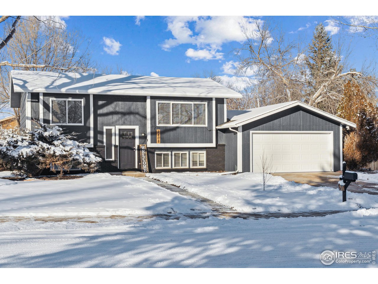 2408 Orchard Place Fort Collins, CO 80521 - Photo 1 of 10 a view of a house and a yard