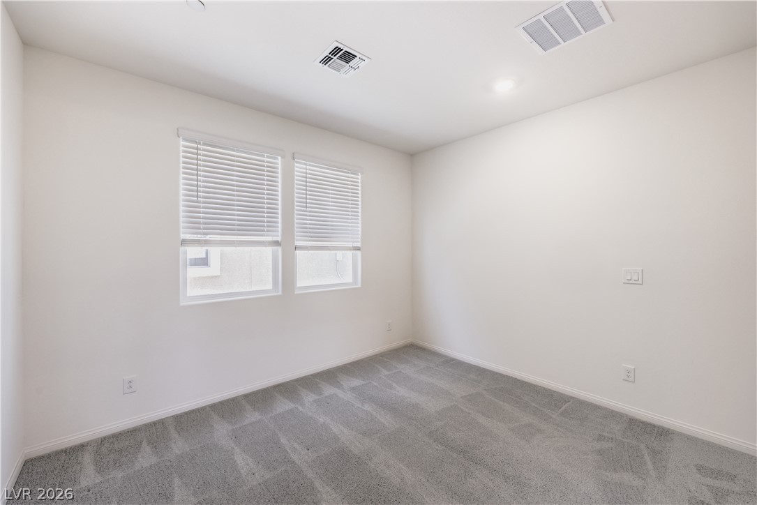 3782 Alla Rocca Avenue Henderson, NV 89044 - Photo 15 of 55 This bright, empty room offers a blank canvas for personalized living with ample natural light.