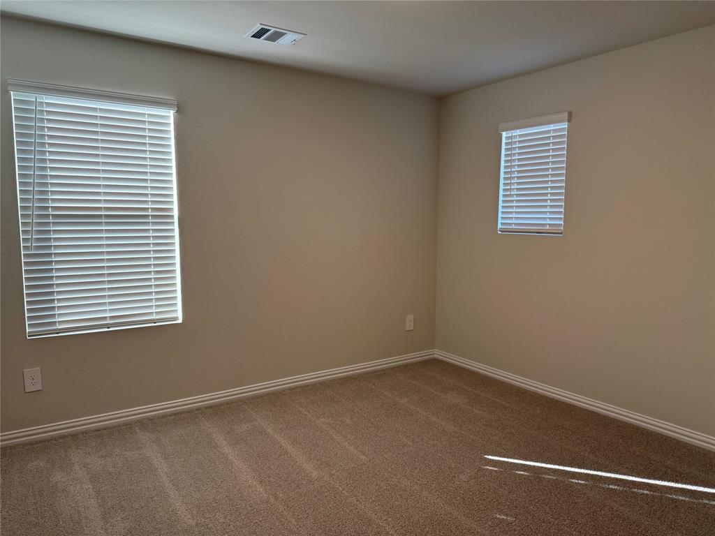 1736 Arches Road Anna, TX 75409 - Photo 13 of 18 Carpeted spare room featuring baseboards