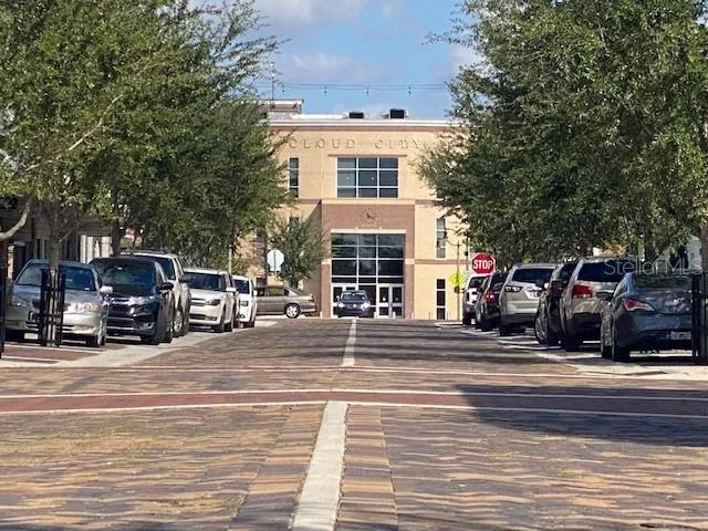a view of a building with car parked