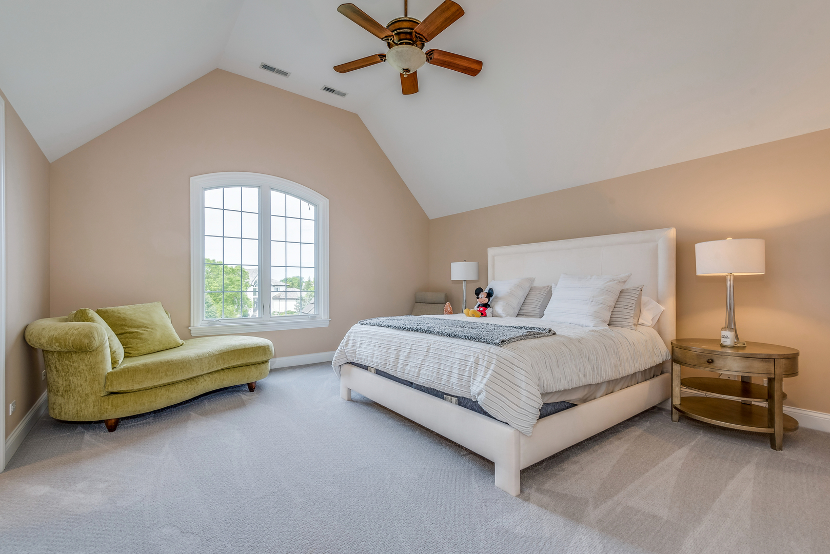 1235 MacAlpin Drive Inverness, IL 60010 - Photo 11 of 20 a spacious bedroom with a bed and a couch