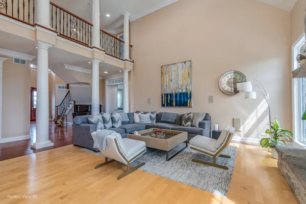 a living room with furniture a rug and a window