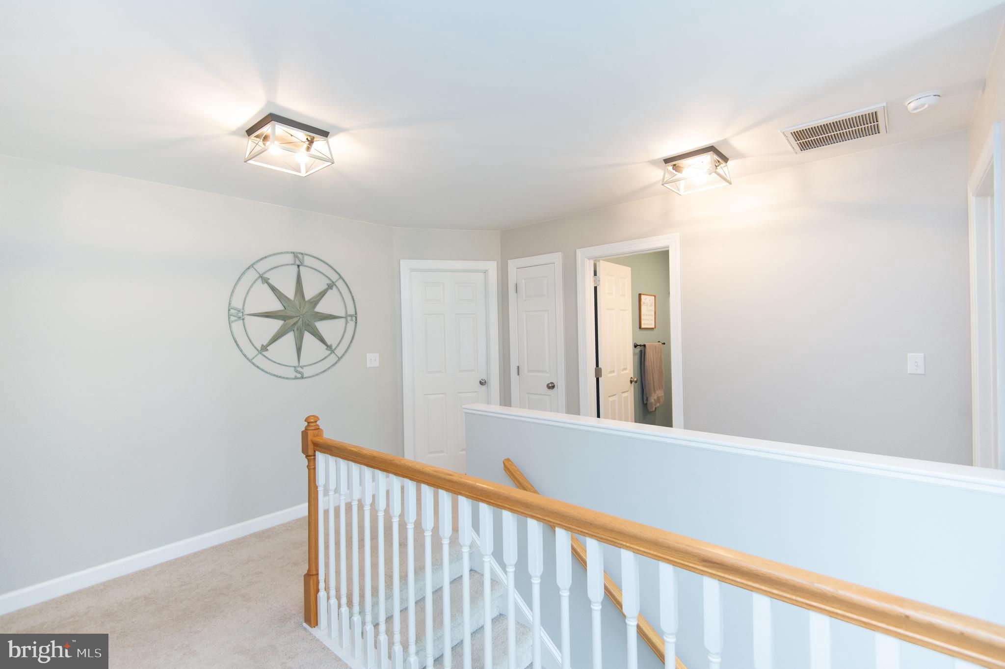 10 Shawnee Road Cambridge, MD 21613 - Photo 34 of 72 Landing separates the sleeping spaces