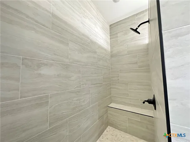 a bathroom with a sink vanity and toilet