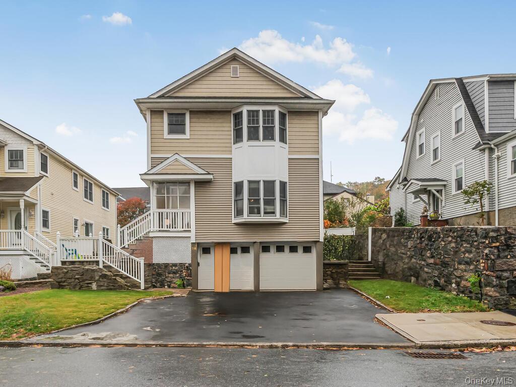 78 Virginia Avenue, Unit 2 Dobbs Ferry, NY 10522 - Photo 1 of 1 a front view of a house with garden