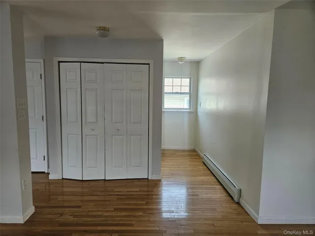 a view of entryway with wooden floor