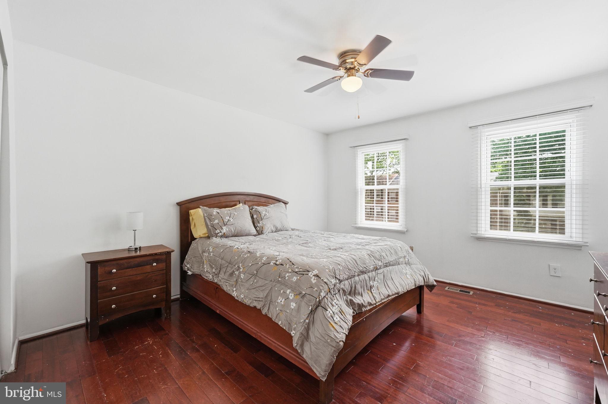 8260 Getty Court Springfield, VA 22153 - Photo 19 of 31 a bedroom with a bed and window