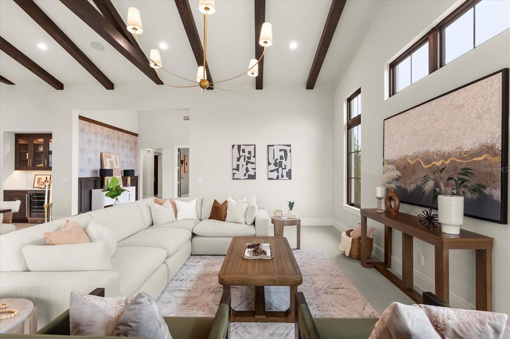 16001 Volterra Point Bella Collina, FL 34756 - Photo 13 of 47 a living room with furniture and a flat screen tv