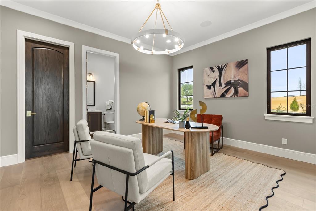 16001 Volterra Point Bella Collina, FL 34756 - Photo 19 of 47 a view of a dining room with furniture a chandelier and wooden floor