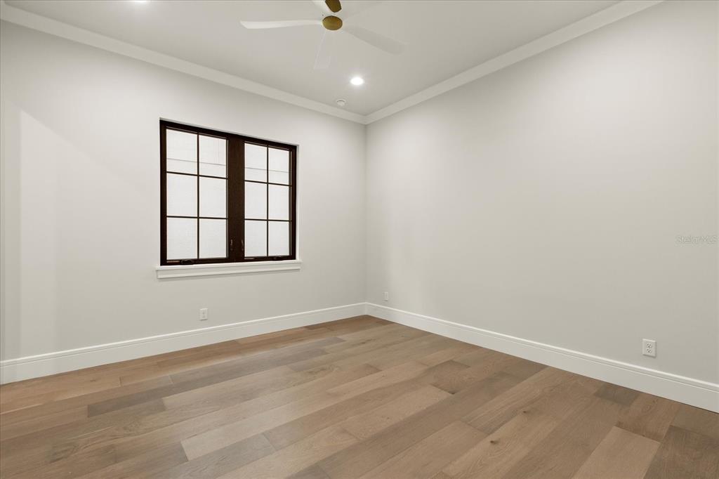 16001 Volterra Point Bella Collina, FL 34756 - Photo 30 of 47 wooden floor in an empty room with a window