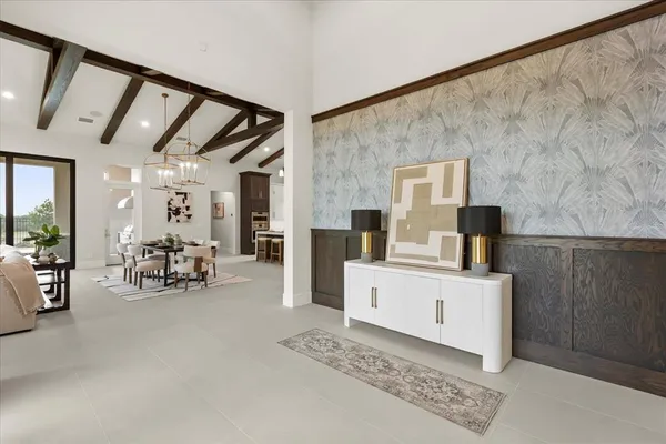 a view of a livingroom with furniture and a flat screen tv