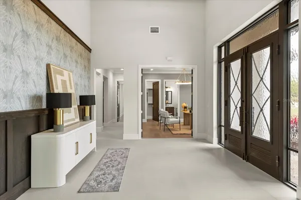 a room with stainless steel appliances kitchen island granite countertop furniture and a kitchen view