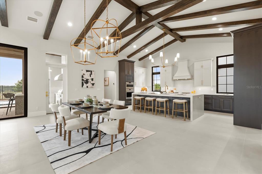 16001 Volterra Point Bella Collina, FL 34756 - Photo 9 of 47 a room with stainless steel appliances kitchen island granite countertop furniture and a kitchen view