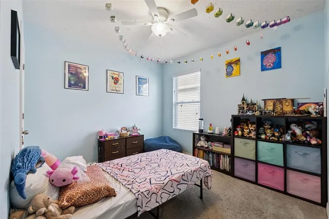 a bedroom with a bed and a dresser in it