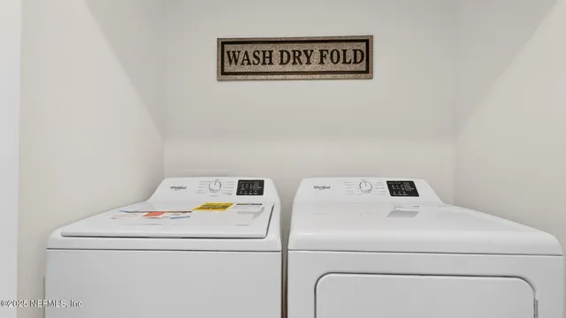 a utility room with dryer and washer