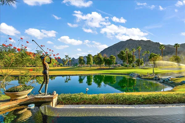 a view of a lake with a yard