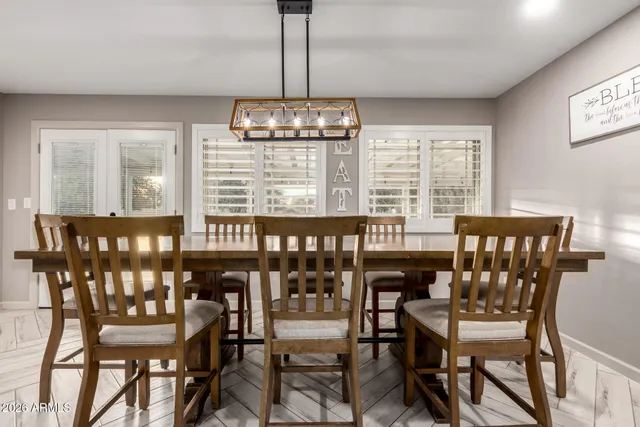a view of a dining room with furniture window and outside view