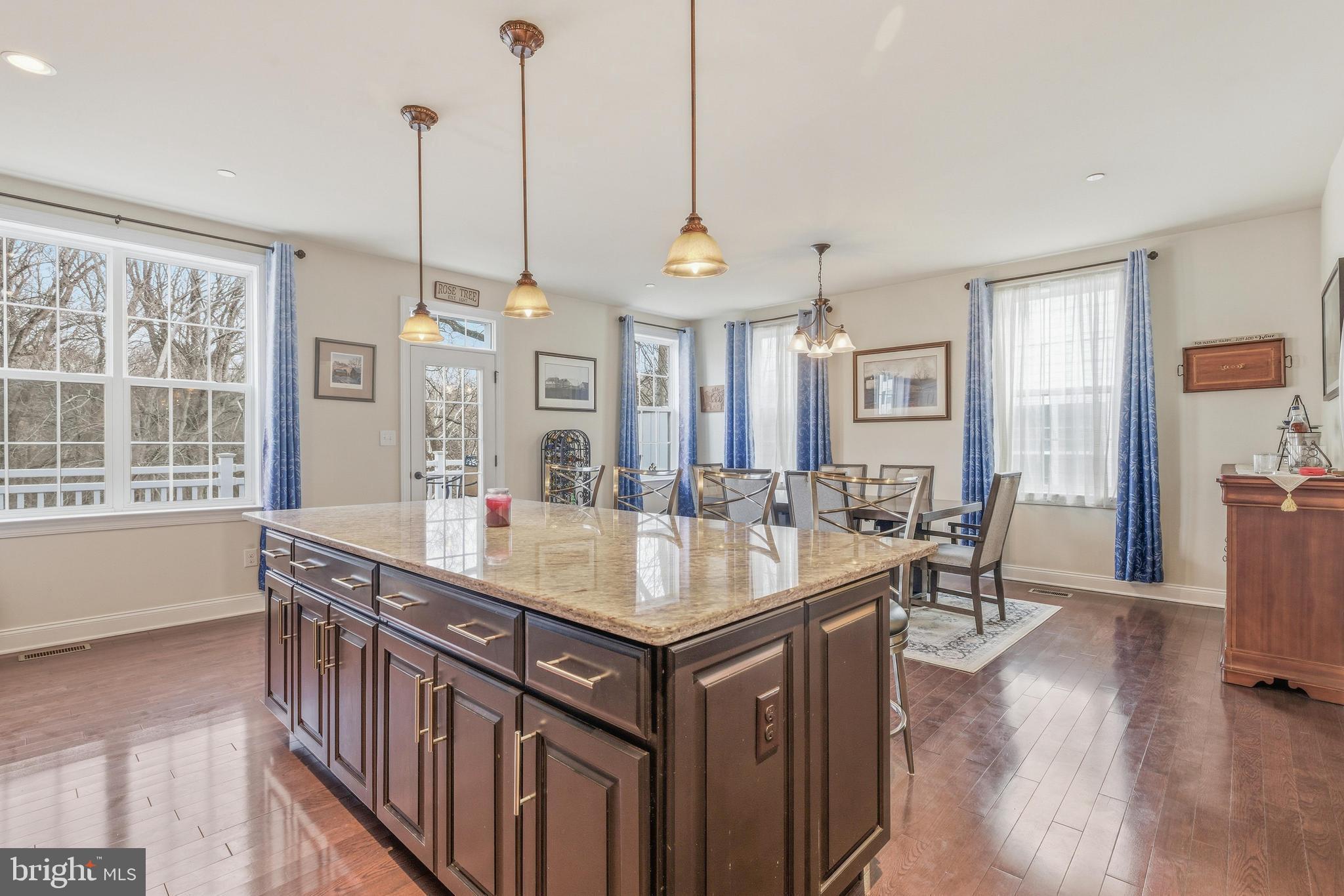 309 Corvus Circle Springfield, PA 19064 - Photo 11 of 34 a kitchen with granite countertop a sink a counter top space and living room view