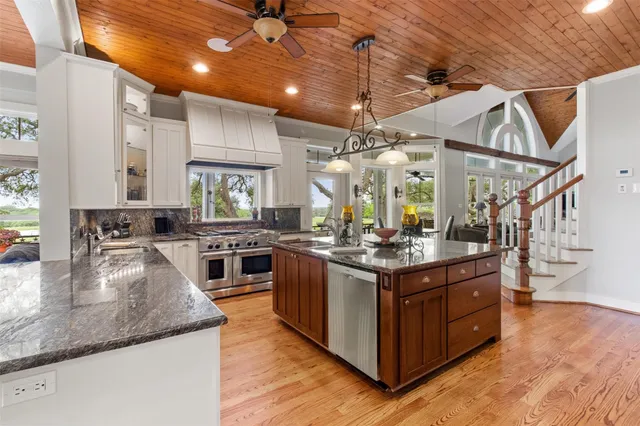 a living room with furniture fireplace and flat screen tv