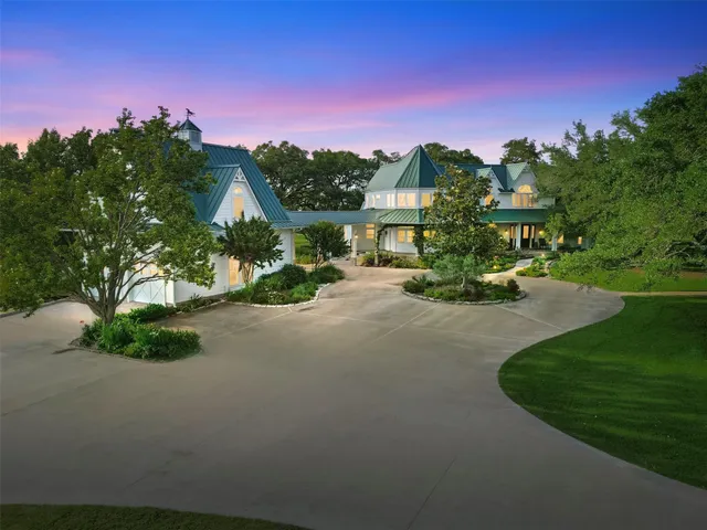 a view of a green field with lots of bushes