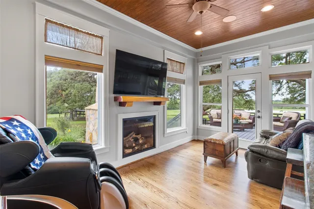 a bathroom with a granite countertop sink and a large mirror