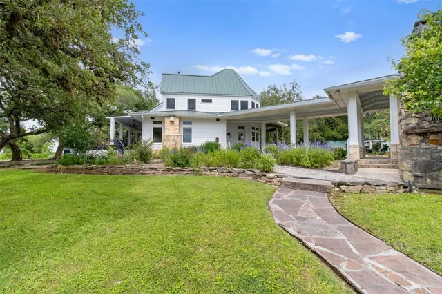 a view of a bench and trees in the background