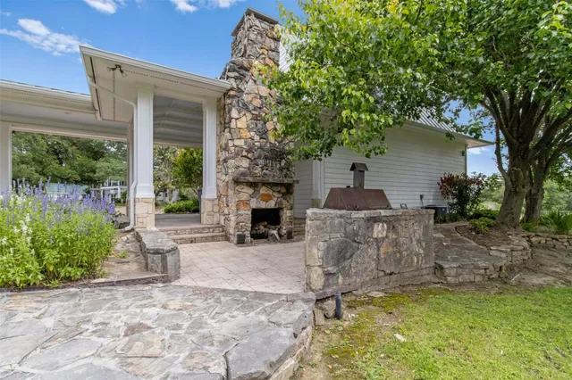 a living room with furniture fireplace and flat screen tv