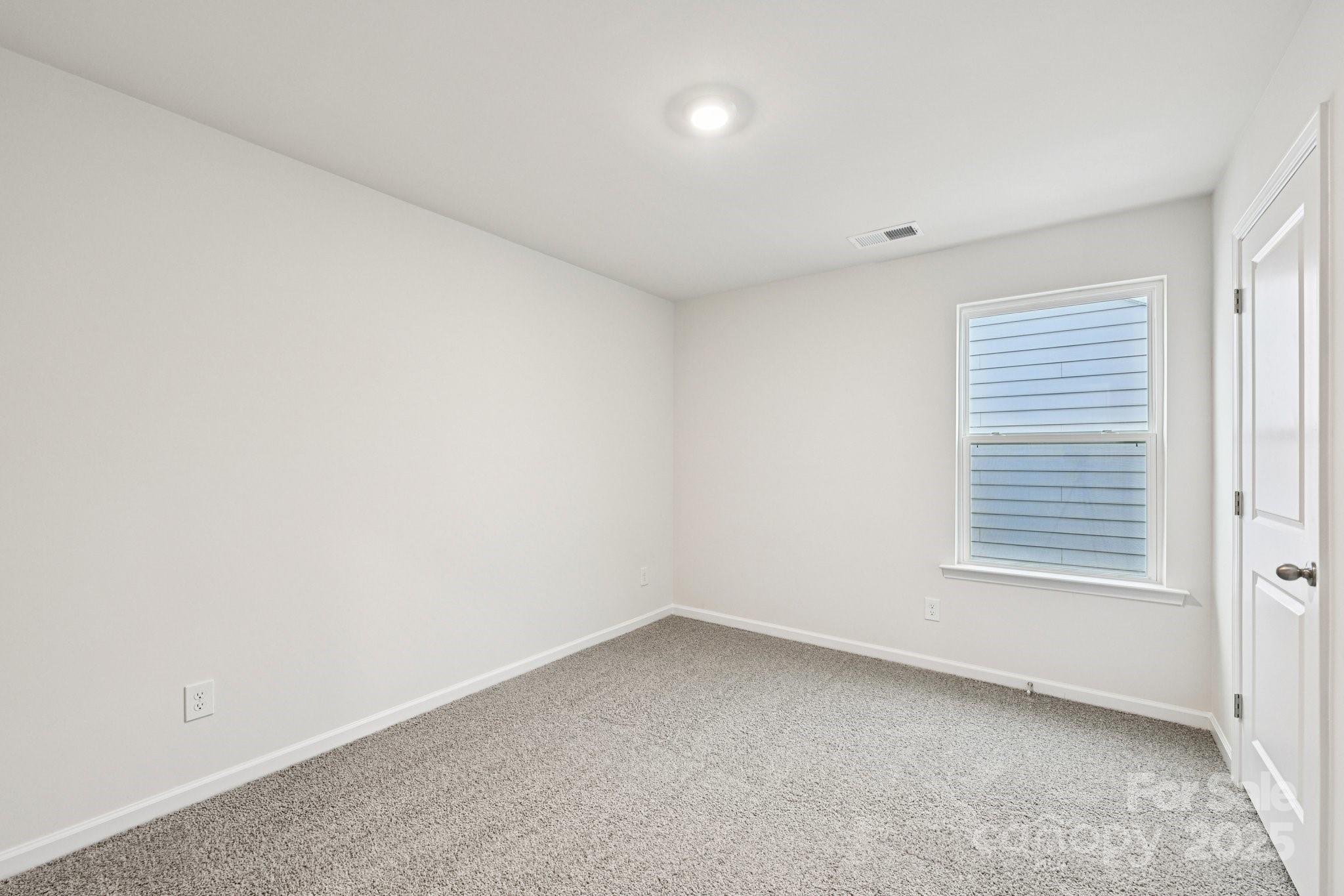 7648 Bainbridge Road Sherrills Ford, NC 28673 - Photo 24 of 25 an empty room with a window