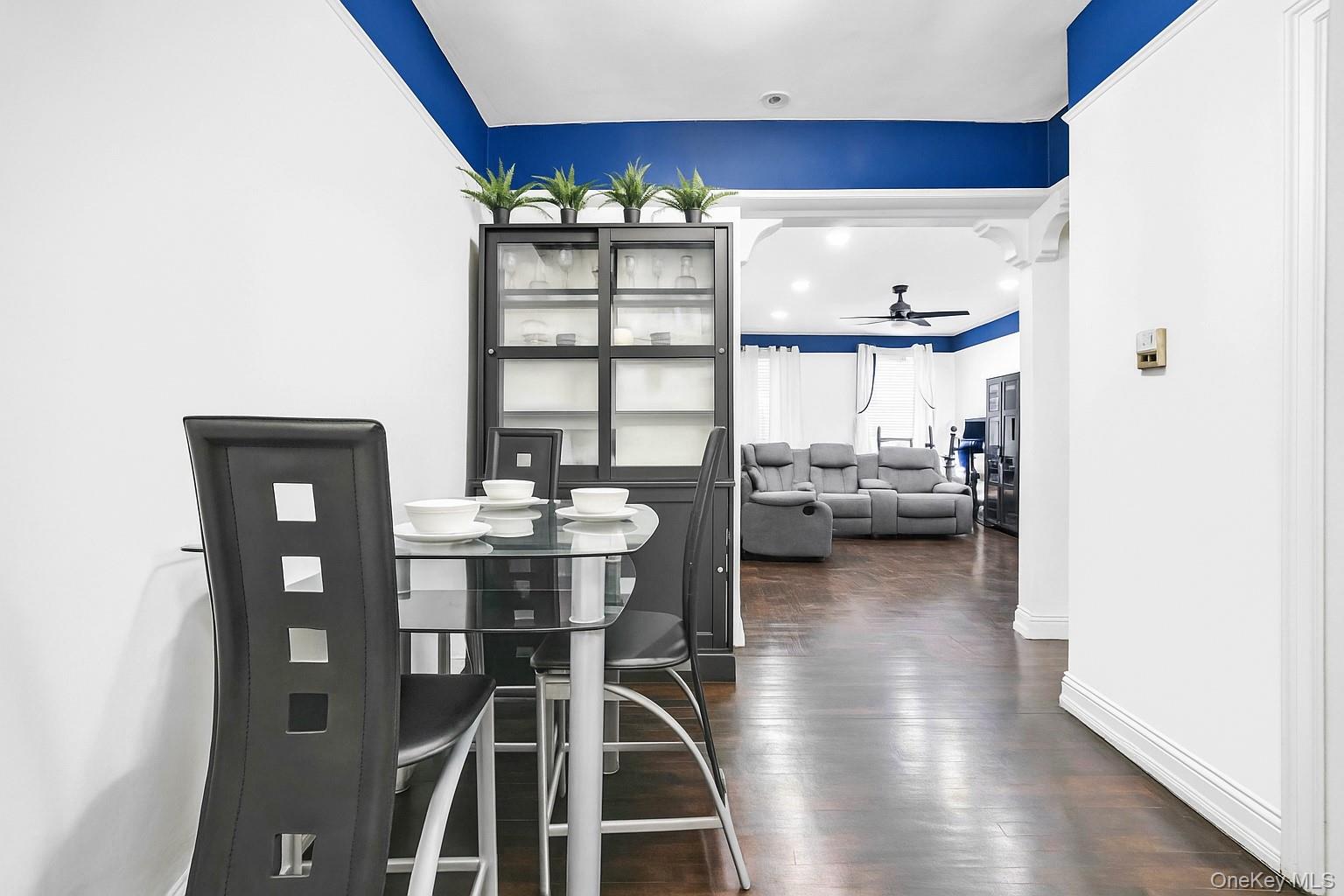 3420 83rd Street, Unit 4F Queens, NY 11372 - Photo 4 of 12 a view of a workspace with furniture and wooden floor