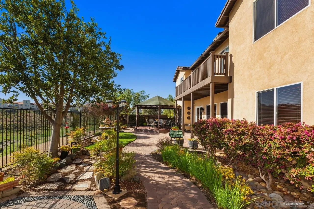 16290 Deer Ridge Road San Diego, CA 92127 - Photo 33 of 36 a view of a building with a yard