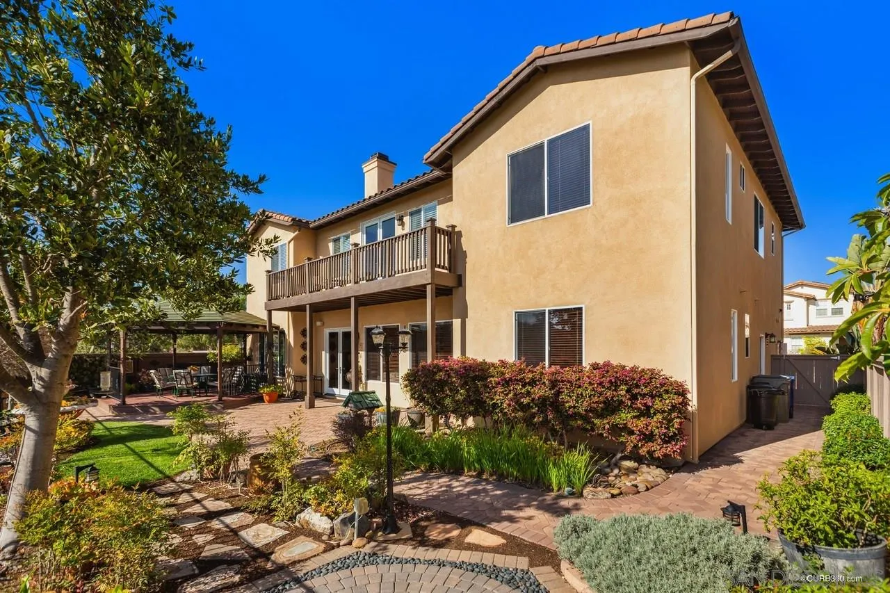 16290 Deer Ridge Road San Diego, CA 92127 - Photo 34 of 36 a front view of a house with a yard