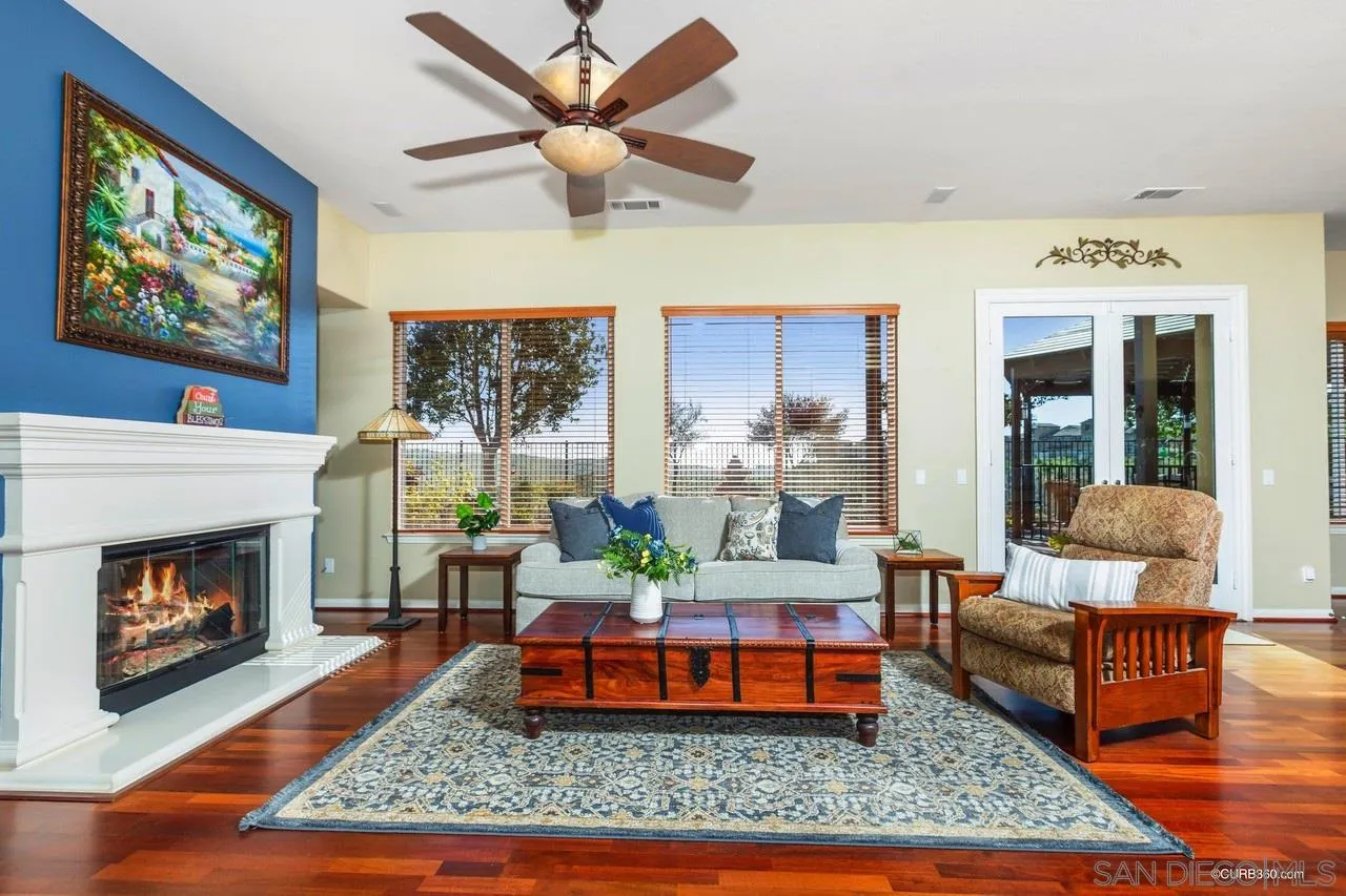 16290 Deer Ridge Road San Diego, CA 92127 - Photo 5 of 36 a living room with furniture and a fireplace