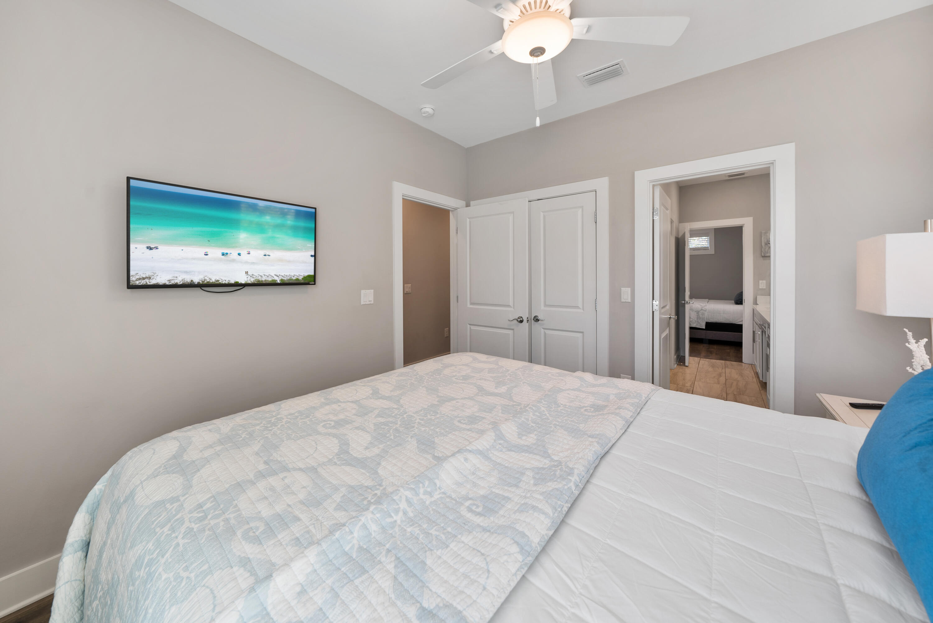 173 West Willow Mist Road Inlet Beach, FL 32461 - Photo 22 of 51 a bedroom with a bed and a chandelier