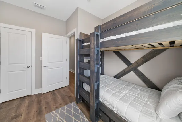 a bedroom with a bed and a dresser