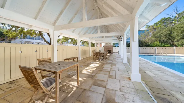 a view of a swimming pool with lounge chair