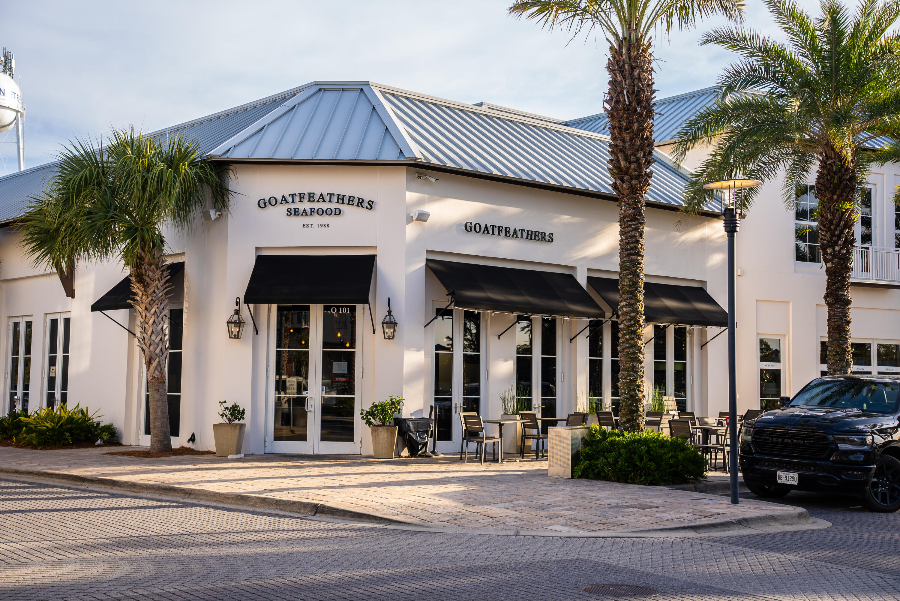 173 West Willow Mist Road Inlet Beach, FL 32461 - Photo 46 of 51 a view of a building with a street sign and palm trees